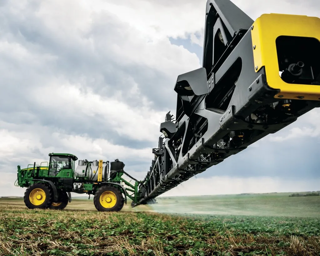 John Deere agricultural sprayer in a field
